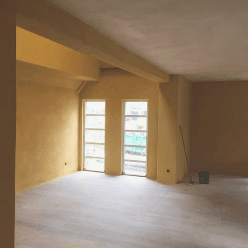 Venetian plaster accent wall with polished marble finish in Montana
