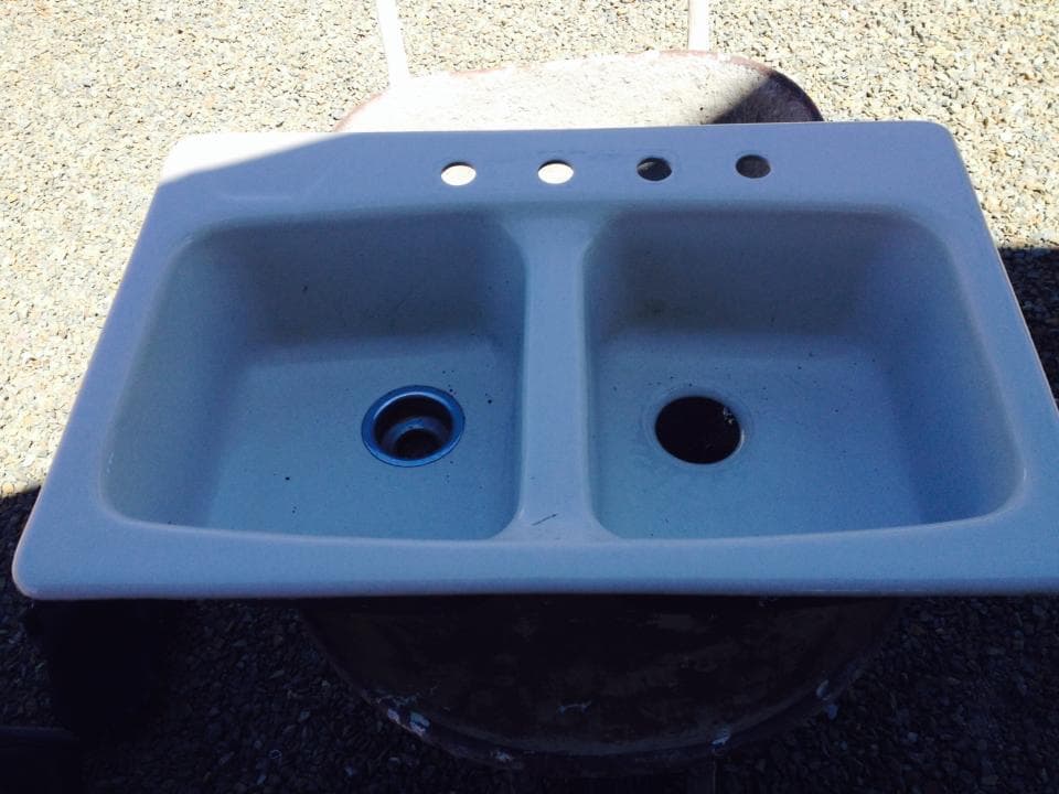 Double basin sink refinished with faux stone