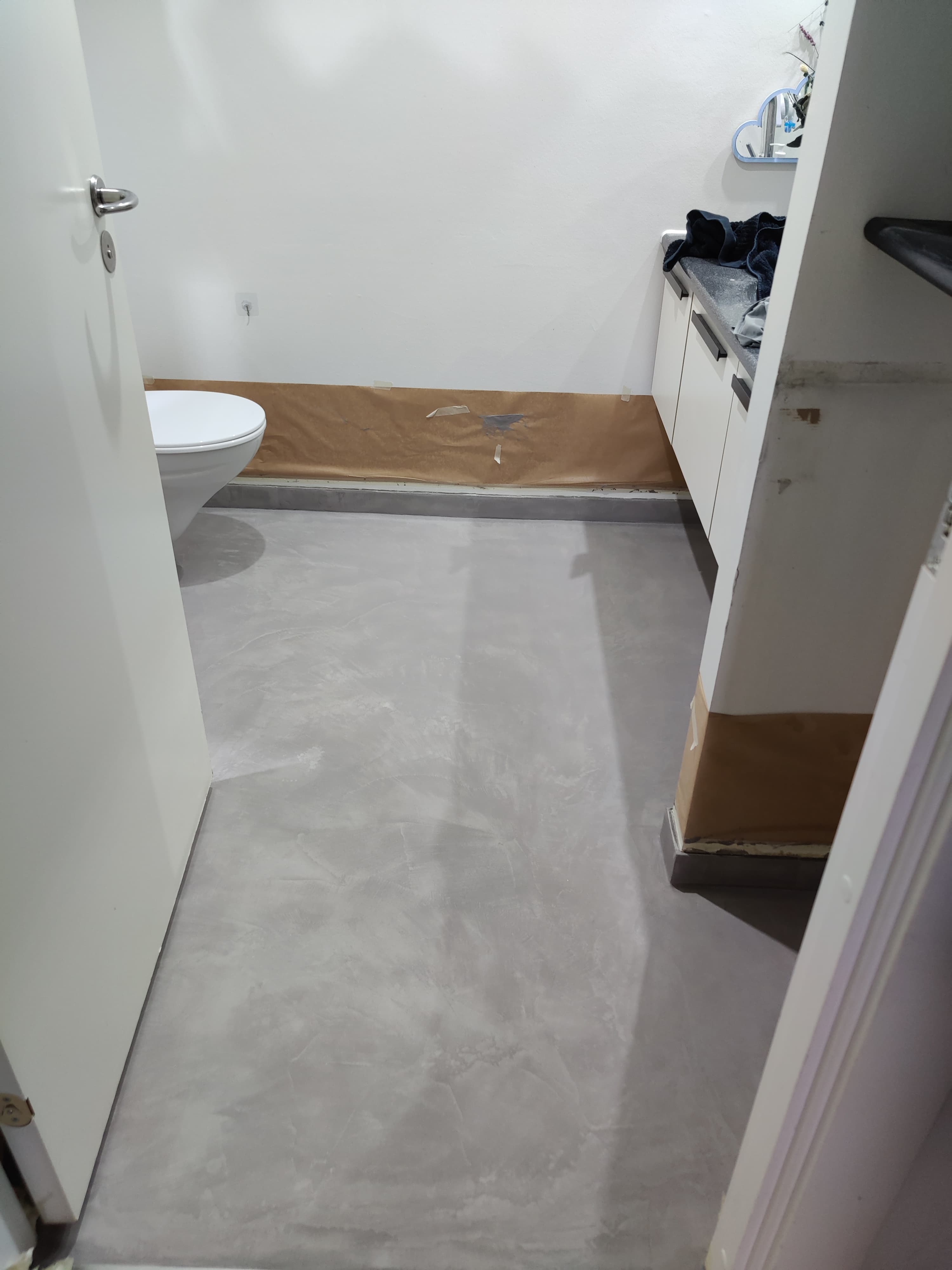 Seamless grey microcement floor by Heritage Coatings