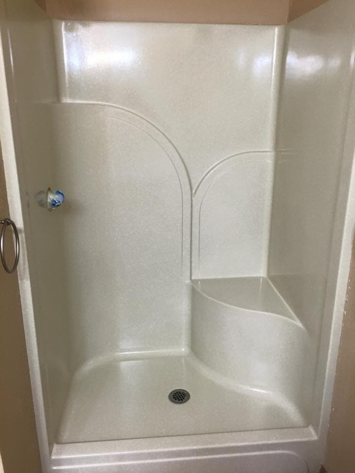Arched shower stall refinished from pink to white