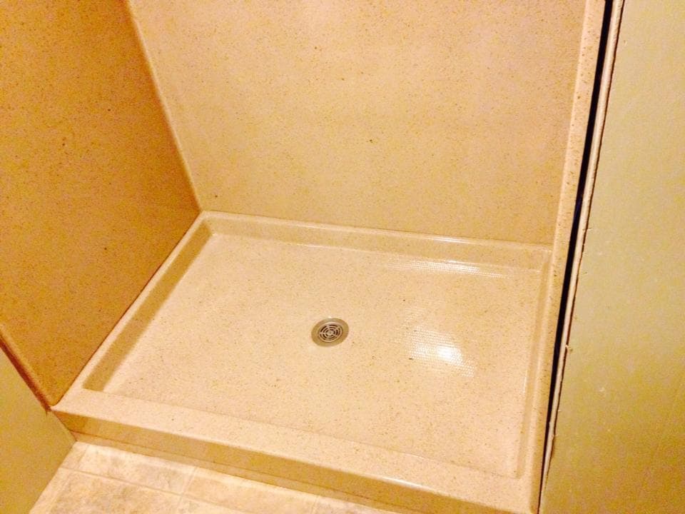 Shower pan and panels refinished in faux granite