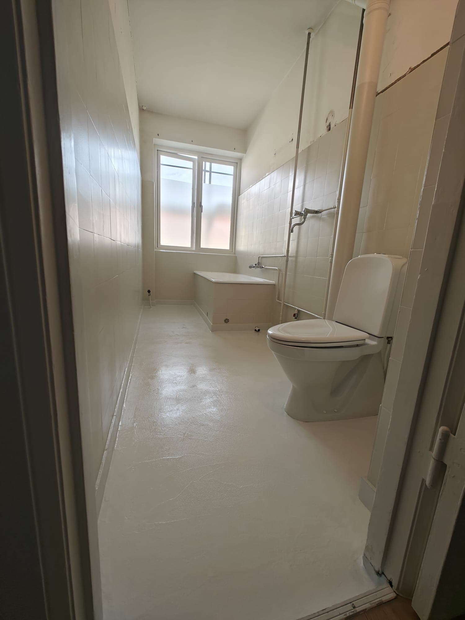 Textured epoxy bathroom floor with slip-resistant coating finish