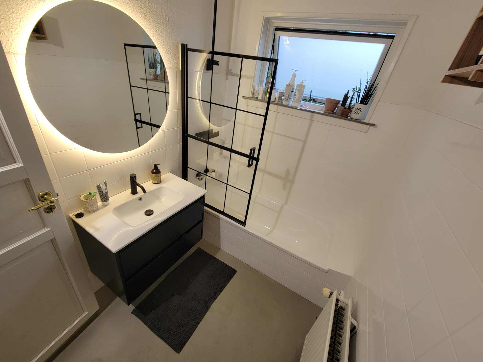 Raw Concrete Gray Microcement Floor, Refinished White Tub and Tiles