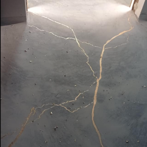 Two-tone microcement floor with gold veining accent in Helena, Montana