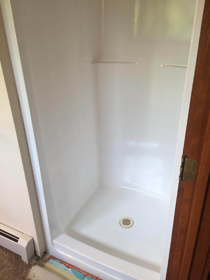 White single-stall shower refinished by Heritage Coatings in Helena, Montana